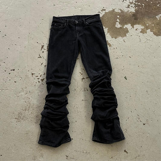 Acne Studios Ruched low-rise flared coated-denim jeans